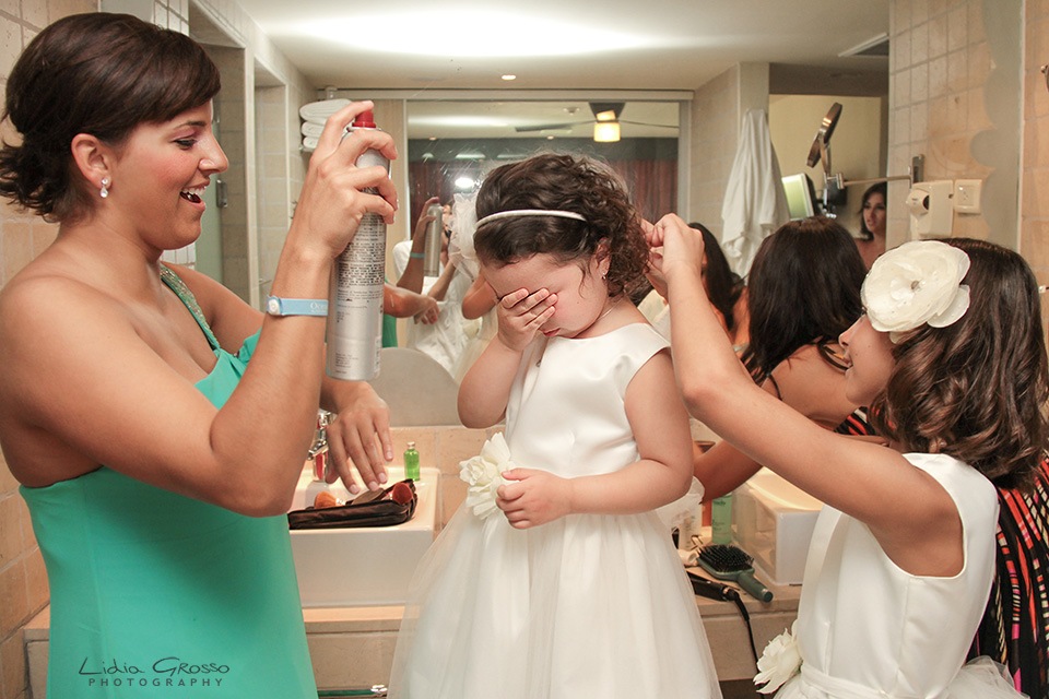 Flower girl getting raedy Iberostar cancun wedding photographer